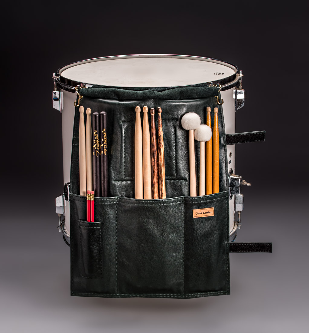 Shown here is the inside of the Great Leather Drumstick Bag. It's inner large pocket divisions holds drumsticks and mallots and has a pencil pocket for drummers music notations. This piece of musicians gear is the only stick bag that has these velcro strap closures instead of the traditional drumstick bag with zippers. It comes in black, brown, and wine full grain leather. It is handmade in the USA and is built to Love and Last!