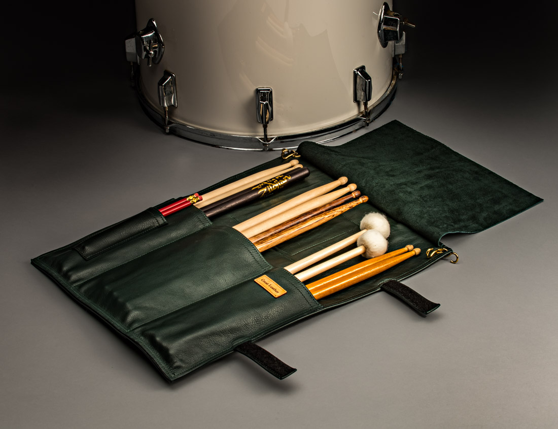 The Great Leather Drumstick Bag s a sturdy all leather custom stickbag for drumsticks, mallets, and other percussion and drum kit accessories. One large divided pocket on the inside easily holds twelve pair of drumsticks, and has a small pocket for pencils so the drummer can make his or her notations on their music sheets or staff paper. There are two outside pockets for carrying a drum key, drumstick wax, stick or finger tape, cymbal polish, and other miscellaneous drummer necessities.